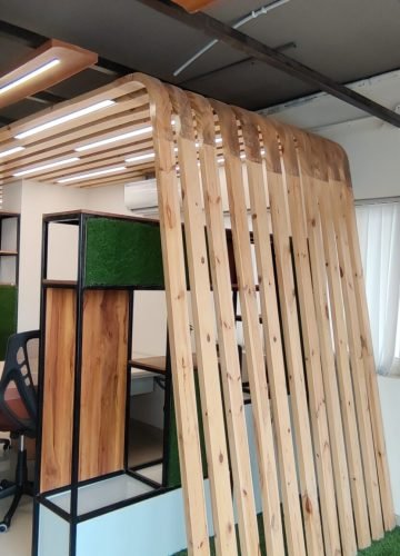 Open office workspace interior with wooden slat partitions